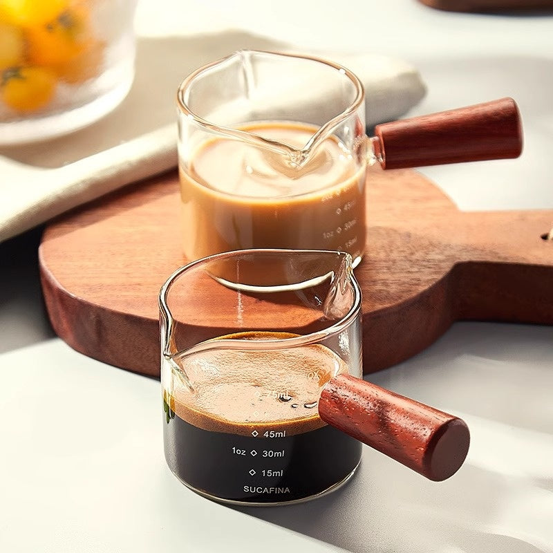 Measuring glass under an espresso machine